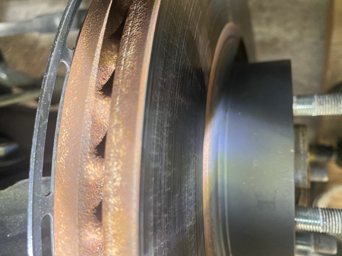 OEM rotor edge view showing material loss and vented internals