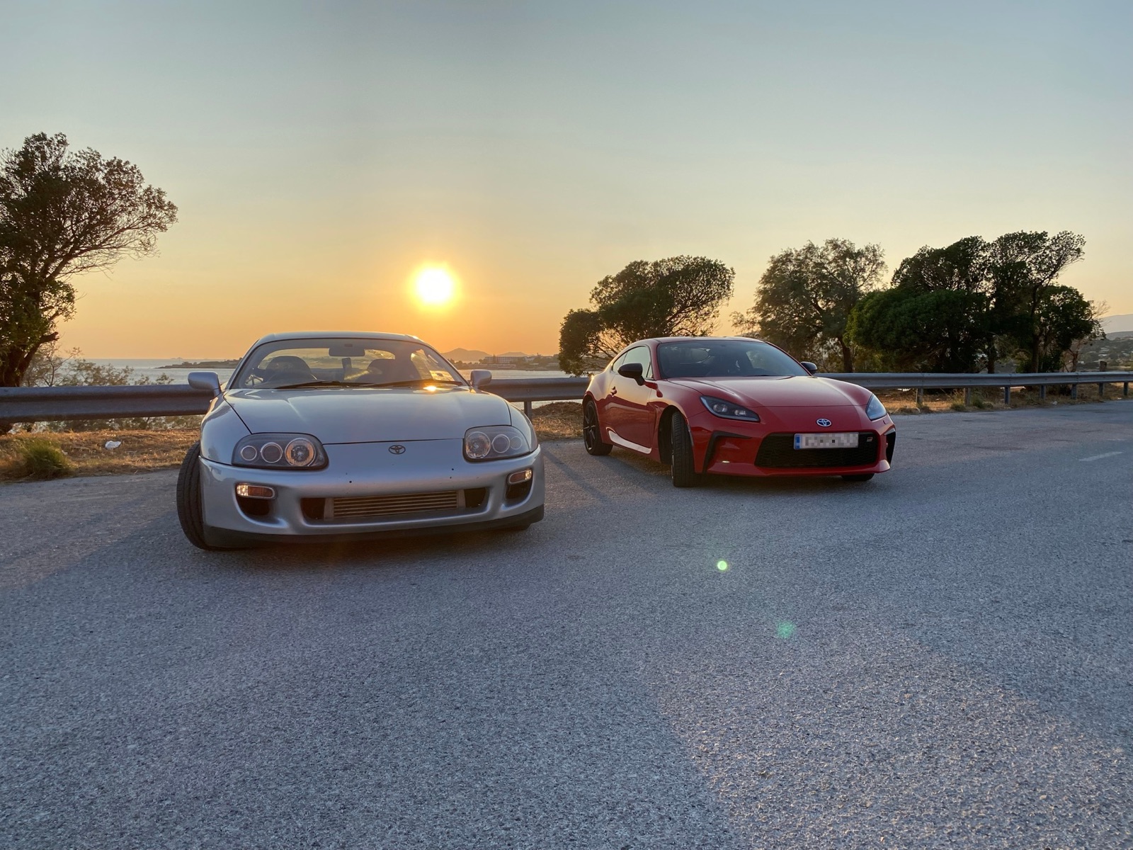 Supra and GR86 front three-quarter in golden hour light